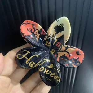 Pince à cheveux fleur avec motifs d'Halloween citrouilles fantômes et chauves-souris