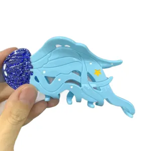 Molla per capelli a forma di medusa blu con glitter e dettagli a stella in acetato