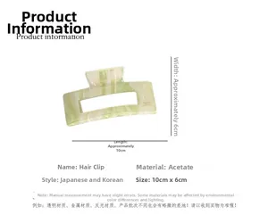 Detalle de pinza de pelo de acetato de 10cm con textura de mármol y dimensiones