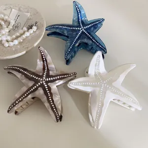 Pinces à cheveux élégantes en acétate en forme d'étoile de mer, bleu marine et nacre
