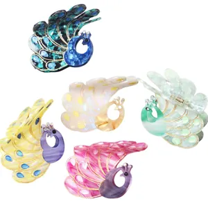 Detailed macro view of acetate peacock hair claws with sparkling rhinestone accents