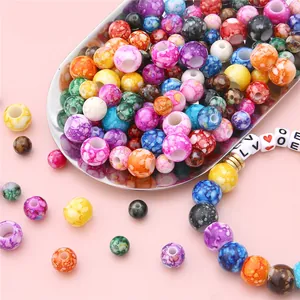 Macro shot of colorful acrylic flower beads with marble texture for DIY jewelry making