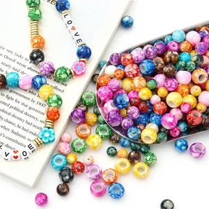 Macro shot of colorful acrylic floral beads and LOVE letter beads for DIY jewelry making