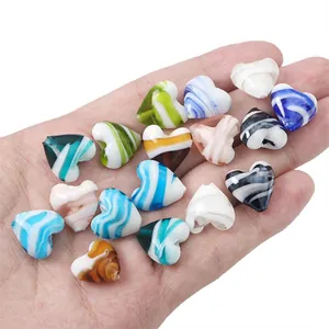 Colorful heart-shaped glass beads with fluid art patterns for DIY jewelry making