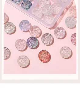 Close-up of assorted macaron colored glass beads with spiral pattern for DIY jewelry