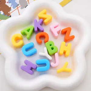 Macro shot of colorful acrylic letter beads for DIY jewelry and phone chain crafting