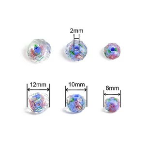 Faceted lampwork glass beads with pink flower patterns and gold glitter for DIY jewelry