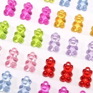 Close-up of colorful translucent acrylic bear pendants for DIY jewelry making and crafts