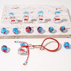 Perles de verre poisson rouge et pendentifs étoile de mer avec bracelet rouge tressé