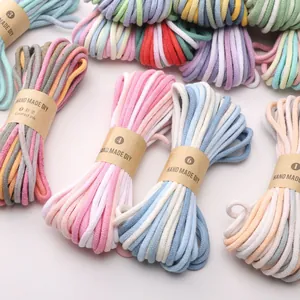 Detail of colorful 4mm cotton braided cords with handmade labels for DIY crafts