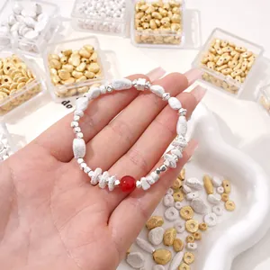 Handmade bracelet featuring frosted silver irregular beads and a central red agate stone