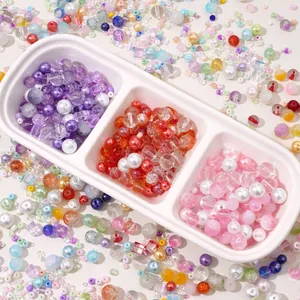 Macro shot of assorted colorful glass pearl and acrylic beads for DIY jewelry making
