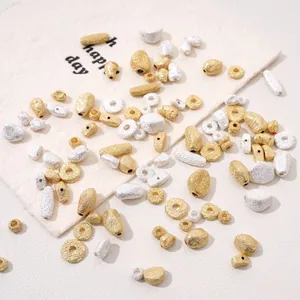 Mix of gold and silver copper beads in various shapes for handmade jewelry DIY projects