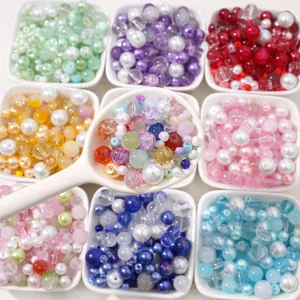 Assorted DIY glass pearl bead kits in white bowls for jewelry making and necklaces
