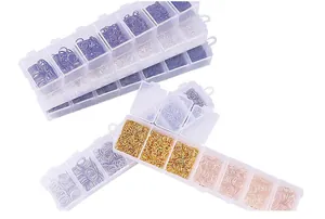 Macro view of assorted 3-10mm jump rings in storage boxes for DIY jewelry making