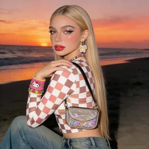 Fashionable Y2K pink checkered crop top and jeans shown at sunset beach for women