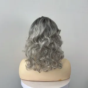 Rear view of medium-length wavy synthetic wig in gradient silver gray with soft curls