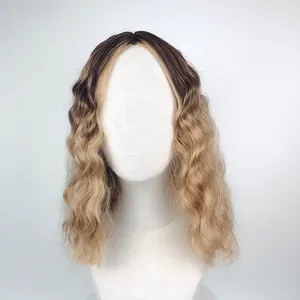 Detail showing the dark brown roots to blonde ombre transition on long wavy hair wig