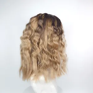 Close-up of ombre dark to blonde wavy synthetic wig fibers on a mannequin head