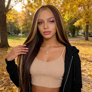 Long straight ombre brown wig with blonde highlights and middle part shown in a park