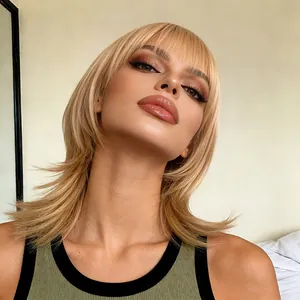 Fashionable blonde medium-length wig with air bangs and layered cut on female model
