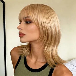 Honey blonde shoulder-length wig with fringe and natural layered inward curl style