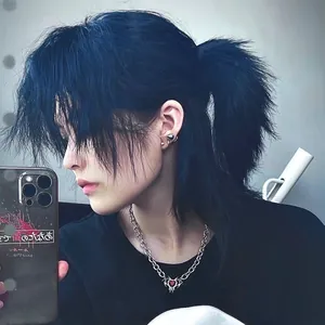 Gothic silver necklace featuring a red heart pendant with silver bat wings and spikes