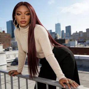 Outdoor close-up of long straight burgundy wig with smooth texture and healthy shine