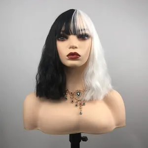 Close-up of Cruella style split black and white wavy bob wig with bangs and texture