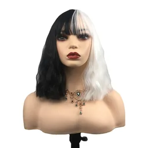 Cruella style black and white split color long wavy wig with bangs on a display mannequin