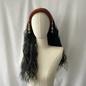 Long wavy black wig with a brown velvet headband and gold tassel jhumka earrings