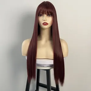 Macro detail of long straight wine red wig with bangs on professional mannequin head
