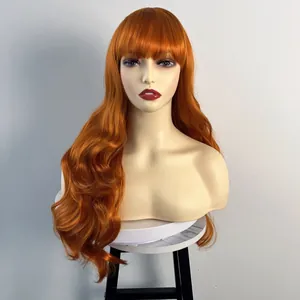 Long wavy bright orange wig with bangs for women shown on a white mannequin head