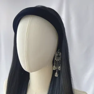 Long straight black hair wig with wide black velvet headband and silver tassel earrings