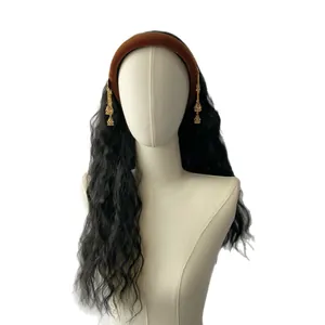 Brown velvet headband with gold tassel charms and long black wavy synthetic hair