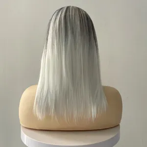 Detailed texture of mid-length ombré wig from dark grey roots to platinum blonde ends
