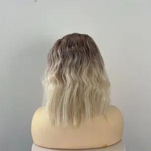 Detail of ombre blonde wavy bob wig with natural dark roots and seamless texture