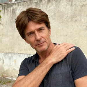 Short wavy brown synthetic wig for men with a middle part and natural voluminous style