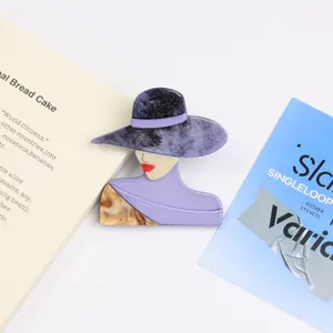 Artistic acrylic portrait brooch featuring an elegant lady with a purple sequined hat