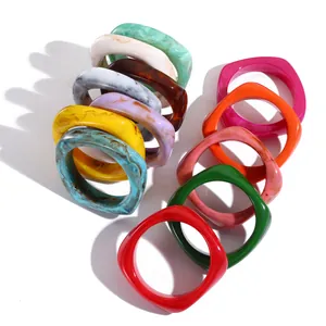 Chic geometric resin bangles in diverse colors like Angola red and emerald green