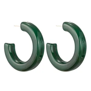 Dark green chunky C-shaped acrylic hoop earrings with a polished glossy finish