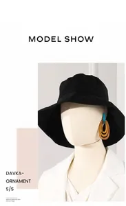 Three-layer acrylic geometric earrings shown on a model for scale and style