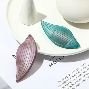 Fashionable acrylic leaf brooch set in teal and burgundy with matte finish textures