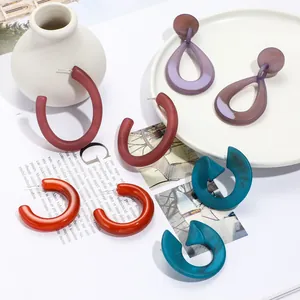 Multicolor acrylic geometric earrings set in burgundy, purple, and teal resin finishes