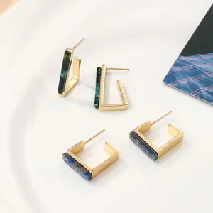 Modern geometric acrylic earrings with gold metal frames in square and triangle shapes