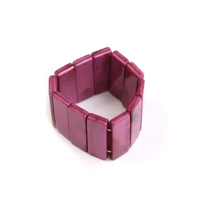 Detailed macro view of the deep burgundy marbled acrylic beads on the elastic bracelet