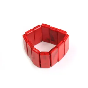 Detail of red marble texture acrylic beads on an elastic bracelet with rectangular links