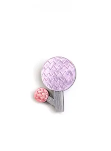 Macro detail of acrylic flower brooch showing wavy texture and soft purple finish