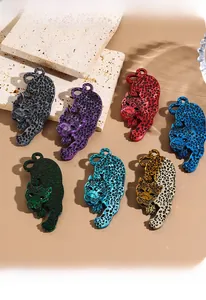 Detailed view of colorful leopard acrylic brooches in stalking pose with texture