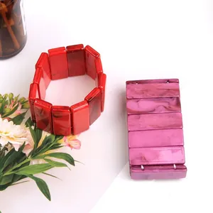 Acrylic bangle bracelet set with red and purple marble textures on a white background